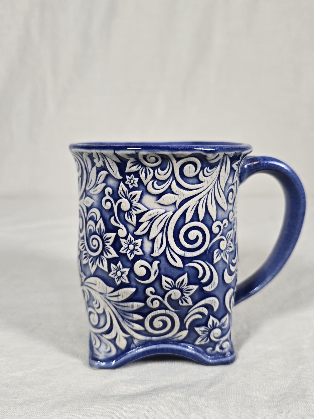 Gerald E Henn Pottery Mug Cobalt Blue White Floral Embossed Stoneware USA